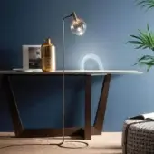 Refined Bonaldo Sofi floor lamp with warm amber borosilicate glass and burnished brass cylinder built with a wood joint