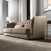 Distinguished DV Home Collection Vogue sofa with warm beige plush textile and matte finish, showcasing deep button tufting and diamond quilting