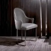 Distinguished DV Home Collection Deco armchair with medium-gray leather upholstery and polished steel base crafted with a hexagon quilted detail