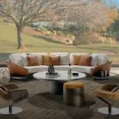 Refined Reflex Segno sofa with light beige fabric cushions and tan leather-like frame built upon a Canaletto Walnut platform