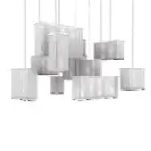 Geometric pendant lights, perforated metal, asymmetrical arrangement of rectangular, cylindrical, and cuboid shapes suspended from white cords.
