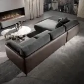 Elite DV Home Collection sectional showcasing Aston or Levante brown leather with Cannetè quilting and plush gray fabric cushions with refined metal feet