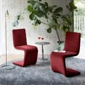 Distinguished Bonaldo Venere chair upholstered in deep red textile with a matte finish and cantilevered form