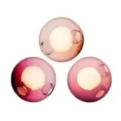 Blown glass ceiling lights, peach to pink gradient, spherical shape with circular cutouts revealing warm light, studio product shot.