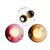Spherical ceiling lights, glass and tinted shades, featuring circular cutouts and warm yellow LED illumination against a white backdrop.