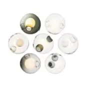 Wall sconces, translucent glass, spherical shades with colored indentations, circular arrangement, warm LED light, minimalist modern design.