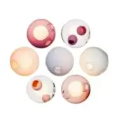 Blown glass sphere lights in blush pink, lavender, and white tones display warm illumination and textured surfaces in a circular arrangement.