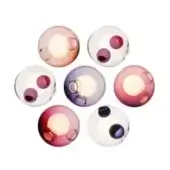 Ceiling lights, translucent glass, spherical shape with amber, purple, pink, and red glass inclusions, three circular cutouts, studio setting.