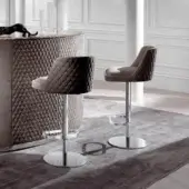 Sophisticated Byron stool from DV Home Collection with brown upholstery, stainless steel base and diamond-quilted backrest crafted in wood
