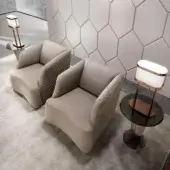 Elegant DV Home Collection Venice lounge chair in smooth beige fabric with refined hexagon quilting and sleek metal base