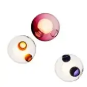 Glass pendant lights, magenta, orange, and purple hues, spherical form with embedded orbs, clear glass exterior, studio lighting.