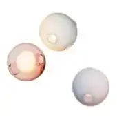 Glass wall sconces, pink and white, spherical shape with diffused light and circular mounting points against a white backdrop.