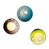 Blown glass wall sconces, teal, brown, and yellow-green, spherical shape with central light opening and translucent surface.