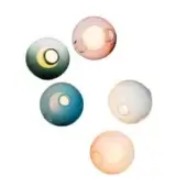 Spherical wall lights, teal, green, pink, gray, peach tones, translucent glass, circular openings, overlapping arrangement, white background.