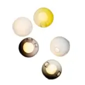 Blown glass wall lights, pale white, yellow, gray tones, clustered spherical arrangement with central apertures and diffused glow.