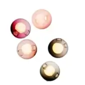 Spherical wall lights, translucent molded glass, staggered arrangement featuring burgundy, blush pink, amber, gray, and blue-gray hues.