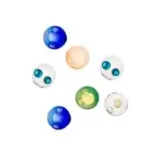 Glass orbs in varied colors display swirling white, peach, green, and blue patterns against a plain white backdrop with diffused lighting.