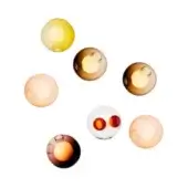 Spherical glass pendant lights in amber, yellow, rose, and red tones display circular openings and glossy surfaces in a dynamic, overlapping arrangement.