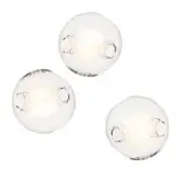 Pendant lights, clear glass, organic sphere shape with brushed nickel fixtures and warm LED illumination in a studio setting.