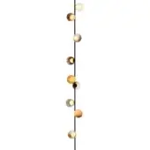 Suspension light fixture, dark metal, eleven amber glass globes, varying sizes, staggered arrangement, diffused lighting, studio shot.
