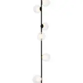 Floor lamp, black matte finish, slender pole with six clear glass globes emitting warm light, minimalist modern design.
