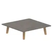 Gray granular square surface rests on four light brown cylindrical supports against a white background