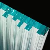 Decorative architectural element, white translucent layered strips with staggered turquoise geometric shapes, reflective surface, black background.