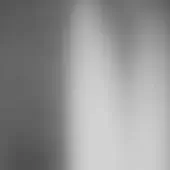 Grayscale gradient background transitions from dark gray to white, featuring a smooth, diffused texture and even lighting with blurred edges.