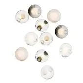 Glass sphere light fixtures, clear to amber, arranged in an organic cluster with diffused warm LED lighting against a white backdrop.