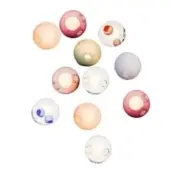 Spherical light fixtures in pink, lavender, beige & clear glass with circular voids, arranged against a white backdrop.