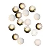 Spherical pendant lights, translucent white and smoky gray, arranged in overlapping composition with visible warm-toned bulbs.