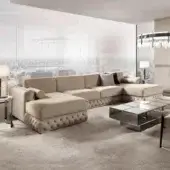 Lavish DV Home Collection sectional crafted in Italy with Italian velvet, button-tufting and metallic trim with a matte finish