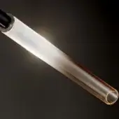 Glass cylinder, amber transparent glass, gradient color, dark metal band, swirling texture, illuminated interior, curved reflective surface.