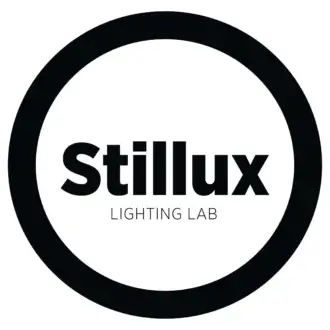 Stillux Lighting Lab logo, black text in a white circle, minimalist design, sans-serif typography, circular composition, monochrome palette.