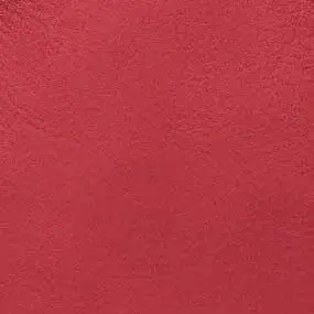 Red stucco texture with embedded text “formitalia > nobч > fuoco”, displaying granular surface and tonal variations in even lighting.