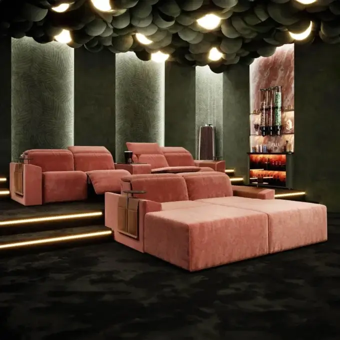 Coral modular sofa with textured upholstery in home cinema, dark gray carpet, green walls, backlit bar, circular ceiling lights.