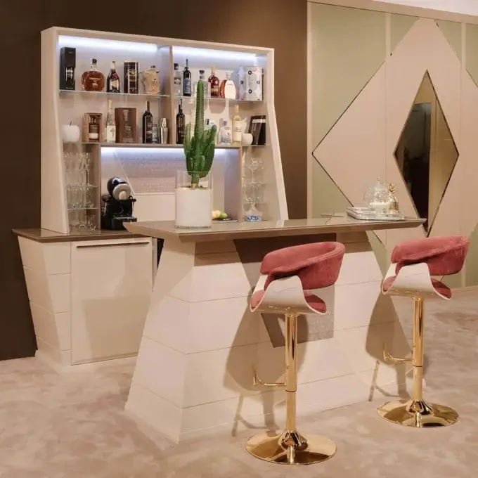 Home bar with cream geometric cabinetry, blue LED lighting, Barovier&Toso glassware, rose velvet stools, and beige walls.