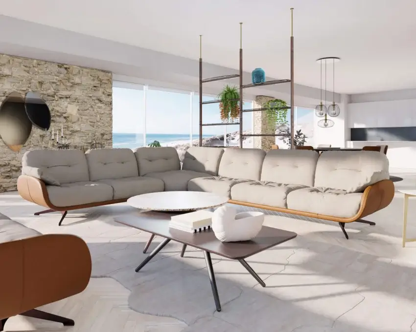 Beige modular sectional sofa with leather accents, marble coffee table, stone wall, metal lamps, beach view, herringbone wood floor.