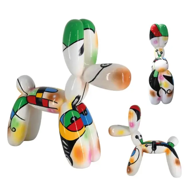 Ceramic dog figurines, Cassoni Juliarte collection, cubist patterns in green, red, yellow, white, black, glossy finish, playful poses.