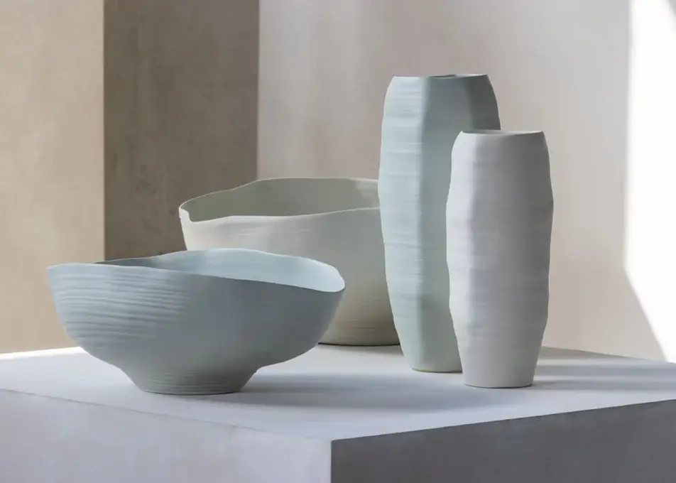 Luxury Rina Menardi Rocce vase sculpted from baked clay with a subtle ribbed texture and tonal variations in pale blue-grey