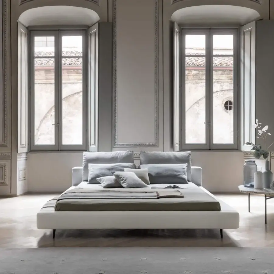 Superior Bonaldo Owen bed with soft gray fabric upholstery and slender dark painted metal feet