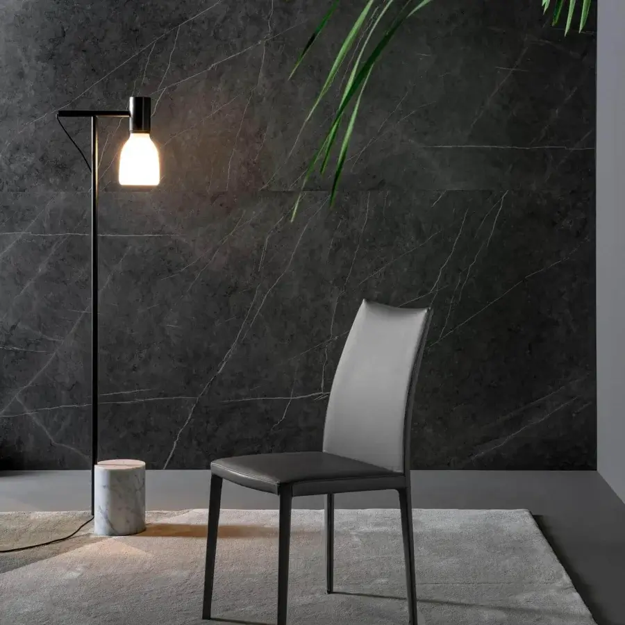 Elegant Bonaldo Kayla up chair showcases light gray fabric upholstery with a matte dark metal frame and legs