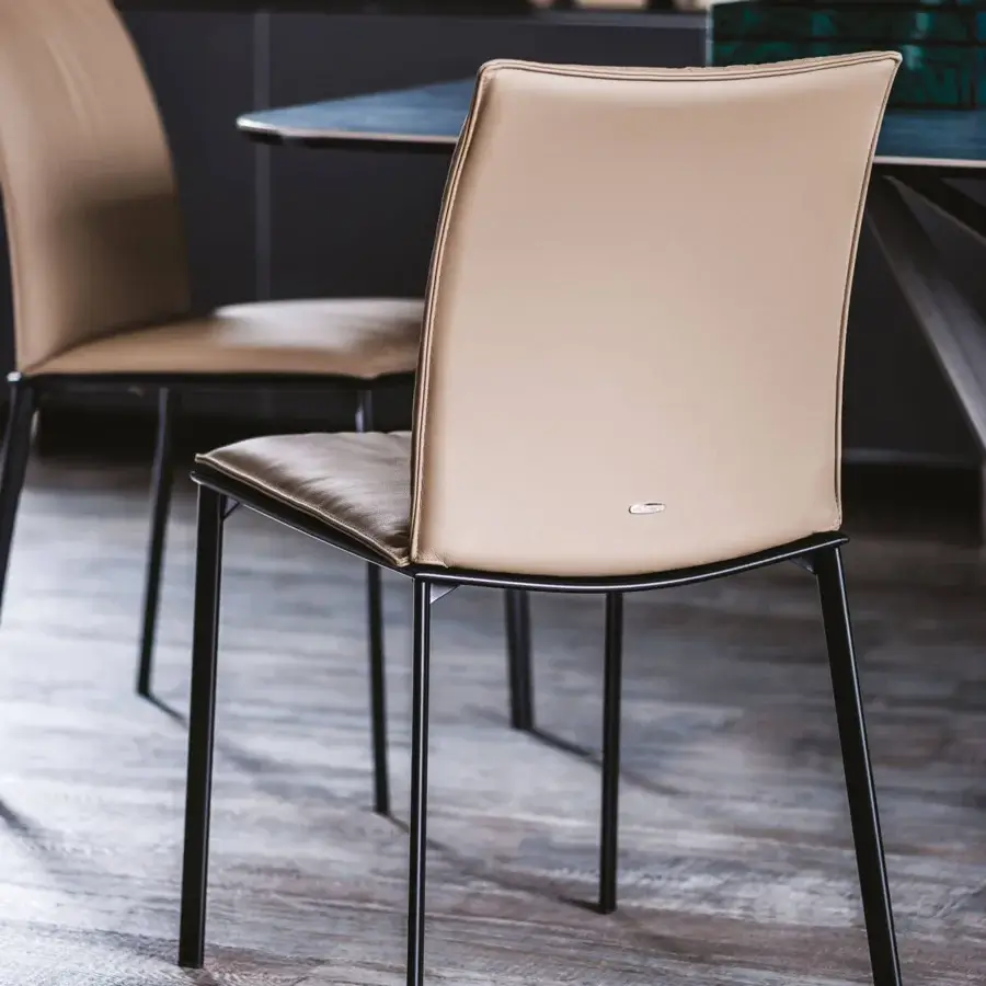 Distinguished Cattelan Italia Rita chair with graphite painted steel frame and soft light tan leather cover