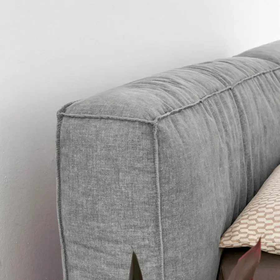 Exceptional Bonaldo Fluff bed with rounded design upholstered in light grey textile and visible stitched padding