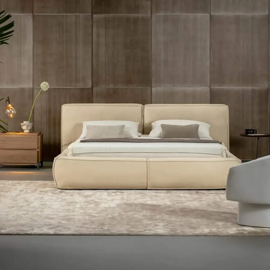 Exceptional Bonaldo Fluff bed with rounded design upholstered in light beige fabric exhibiting a smooth matte finish