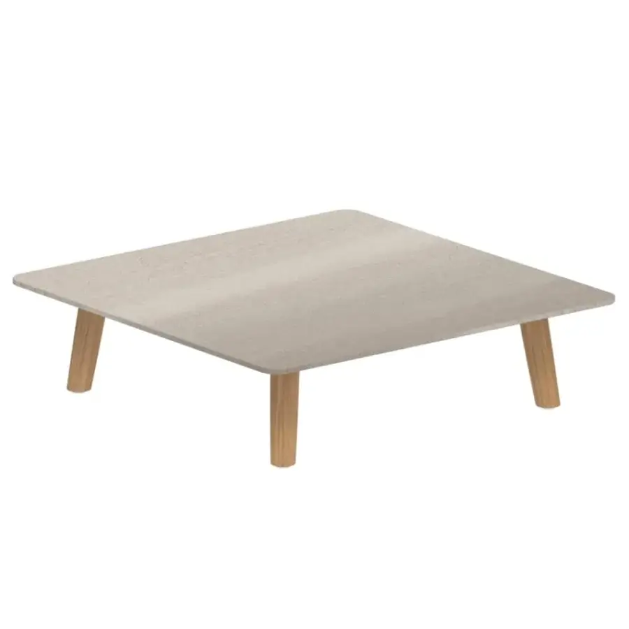 Luxury Royal Botania Mambo Lounge coffee table in rectangular shape with a light beige, textured tabletop and natural wood legs