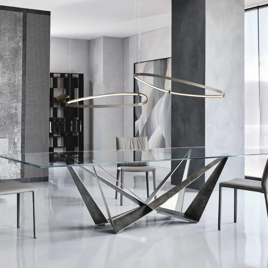 Distinguished Cattelan Italia Skorpio table with a sculptural base in graphite embossed lacquered steel and clear extra-clear glass top
