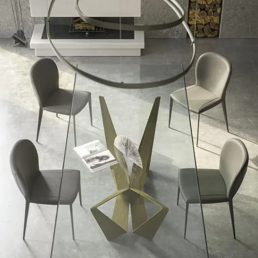 Distinguished Cattelan Italia Skorpio table with clear glass top and titanium embossed lacquered steel base