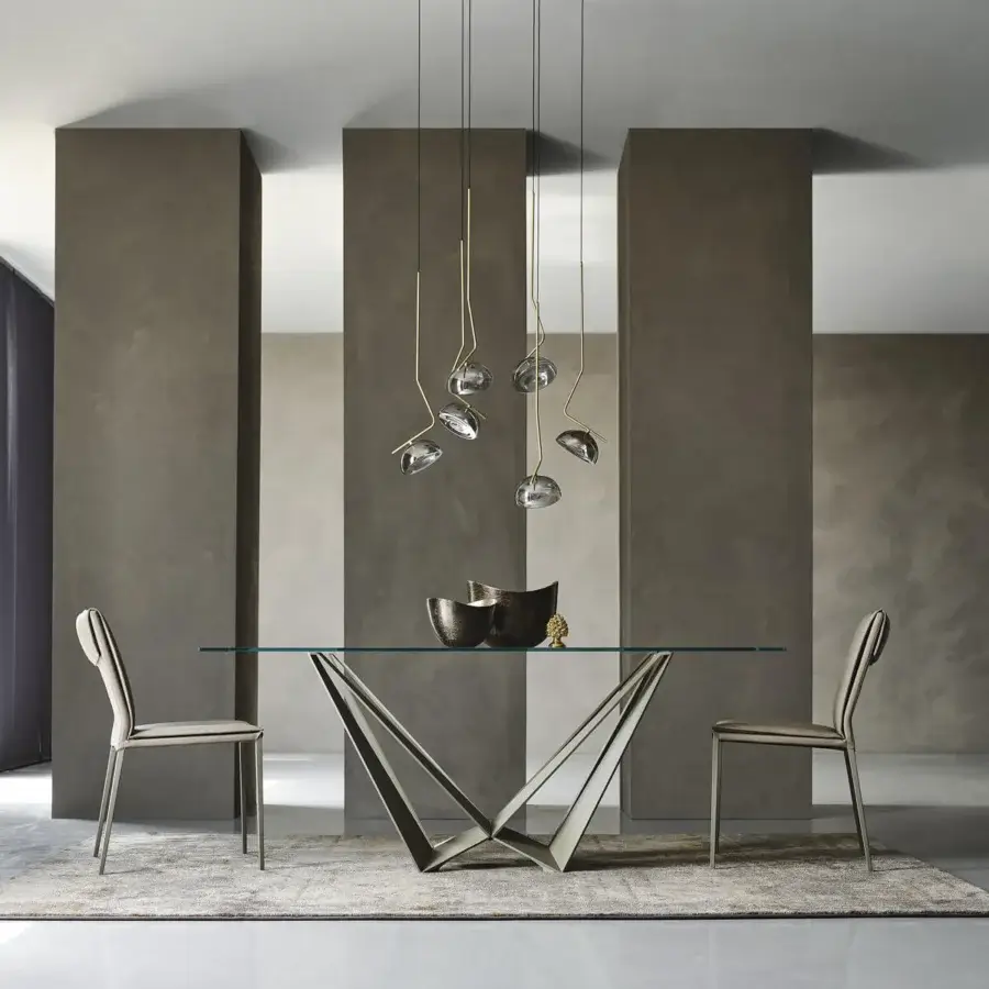 Distinguished Cattelan Italia Skorpio table with clear glass and graphite embossed lacquered steel base in matte gray finish