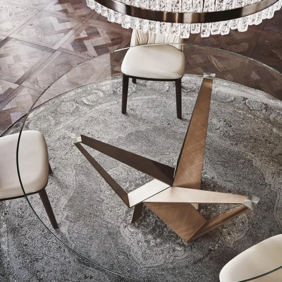 Distinguished Cattelan Italia Skorpio table with clear glass and graphite embossed lacquered steel base crafted with intersecting triangular wooden forms